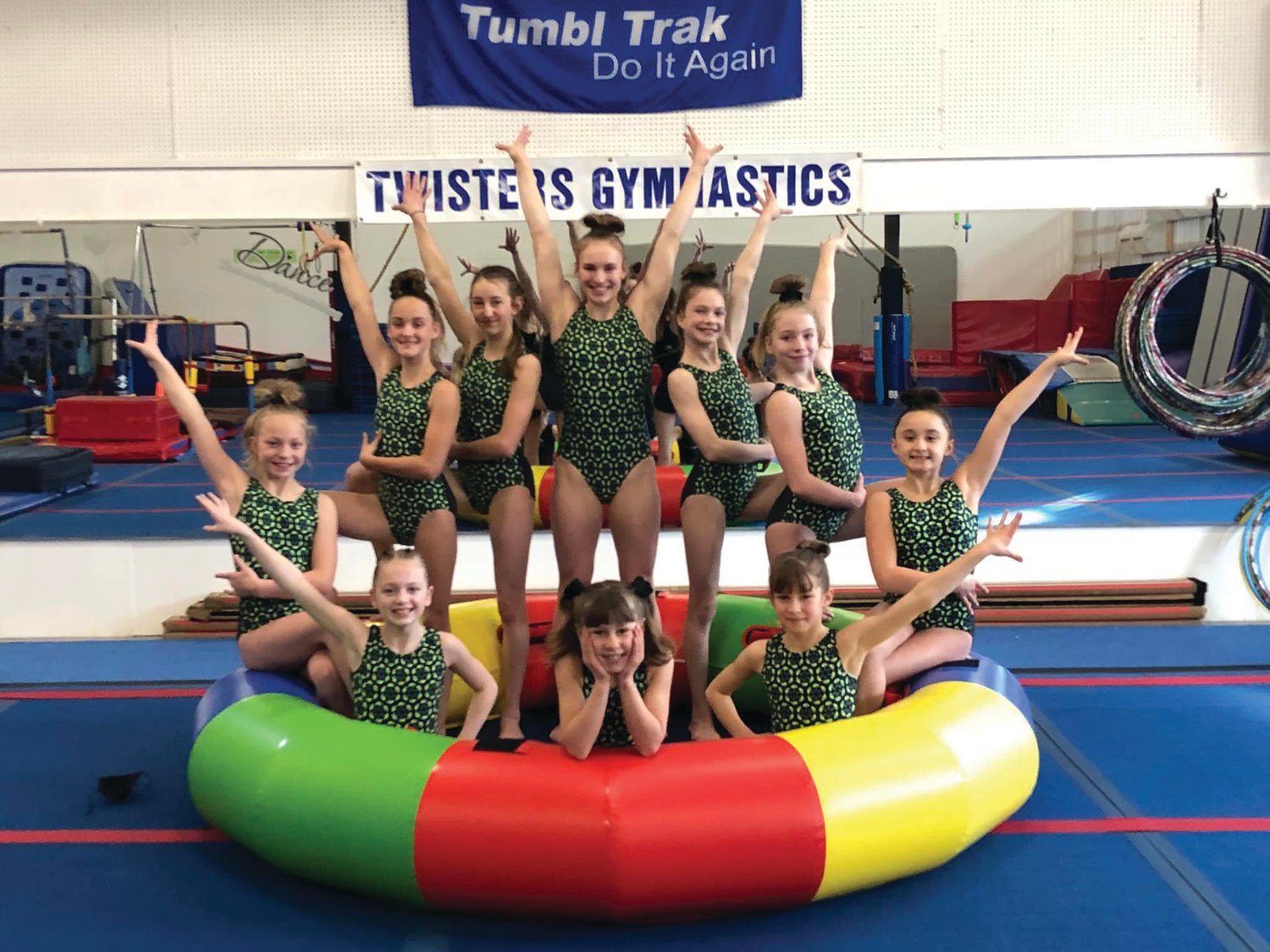 The “Twisters Sisters” Level 6 gymnastics team poses at their gym in Port Hadlock.